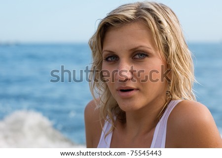 Sexy blonde girl after a swim in the sea.