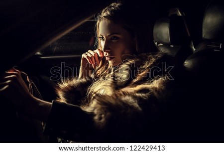 Luxury woman in a car.