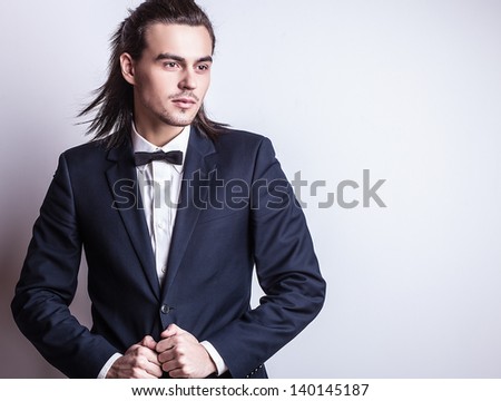 Portrait of handsome long-haired stylish man.