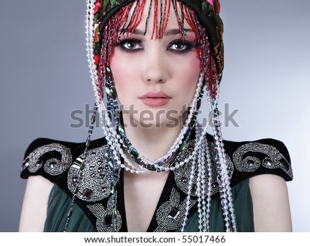 Portrait of Attractive model in exclusive design clothes on manners old-slavic.