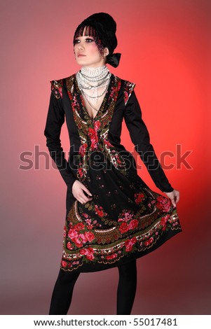Attractive model in exclusive design clothes on manners old-slavic. Photo.