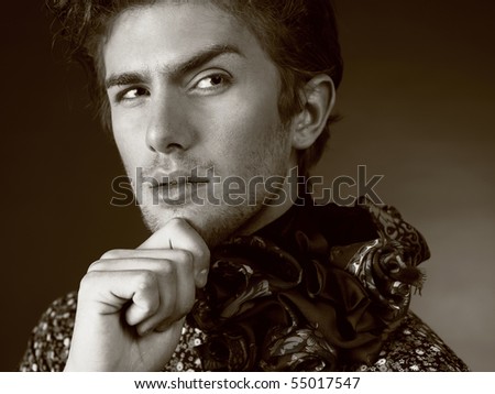 Portrait Beautiful man in exclusive design clothes on manners old-slavic. Photo.