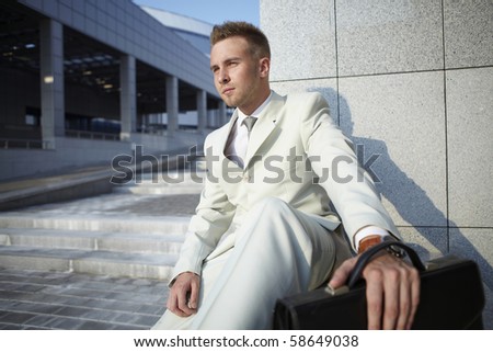 Portrait of an attractive young man outside