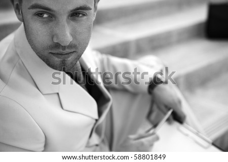 Portrait of an attractive young man outside