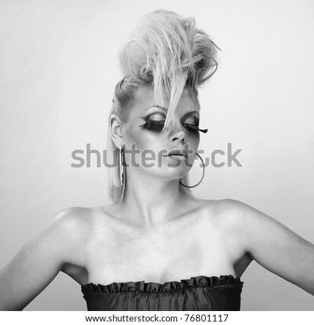 Photo of beautiful woman with magnificent hair. Black-white photo.