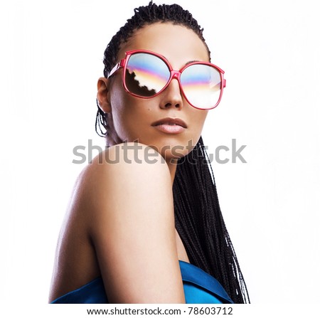 beautiful fashion mulatto woman wearing sunglasses over a white background.