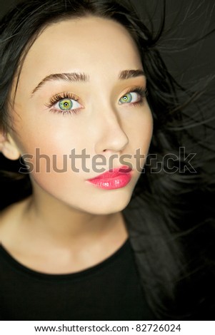 Amazing portrait of beautiful young brunette woman. Close-up face studio photo.