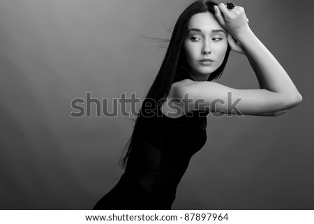 Portrait of a beautiful brunette woman. Black-white Fashion Photo.