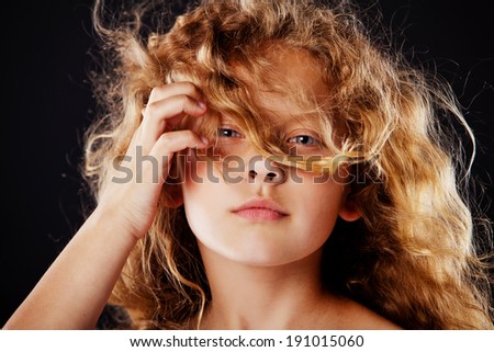 pretty little girl with windy hair. Fashion photo