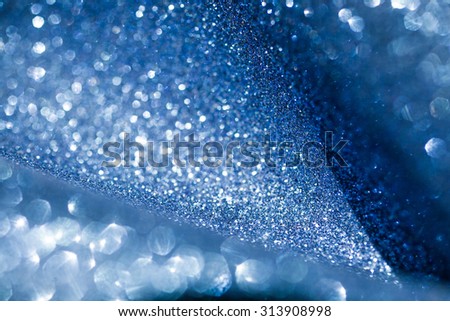 Blue bokeh shiny background. Blue bright defocused background