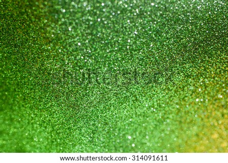 Green glitter bright shiny sparkle background. Green glitter texture for background. Element of design.