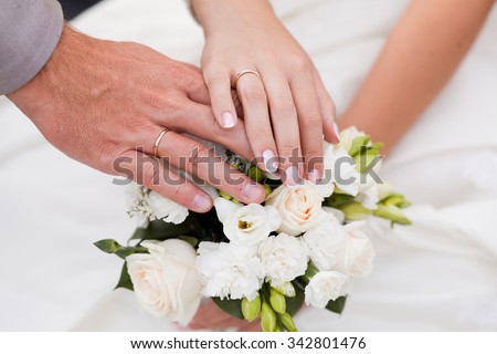 Similar – Image, Stock Photo Couple on their wedding apparel walking by the street