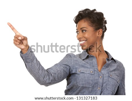 pretty casual black woman pointing with her arm on white background