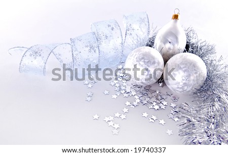 beautiful silver seasonal Christmas decorations on white background