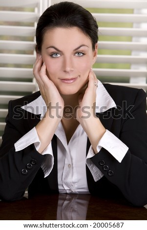 pretty business woman wearing black suit and shirt