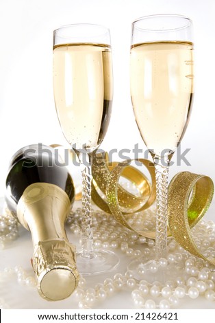 beautiful glass filled with gold champagne white background