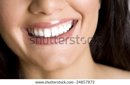 pretty white teeth and beautiful smile of brunette