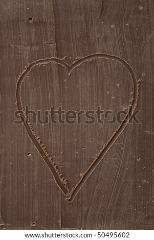 Heart drawn in a block of chocolate
