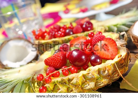 Fruit salad in pineapple on a Hawaiian party