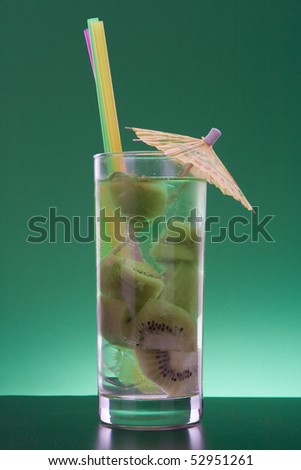 green cocktail of kiwi fruit on a green background
