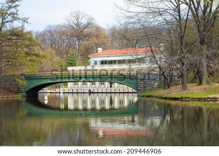 BROOKLYN, NY - APRIL  25, 2014: Historic Boathouse and bridge on lake at Prospect Park in Brooklyn, NYC.  This landmark boathouse was built in 1905.