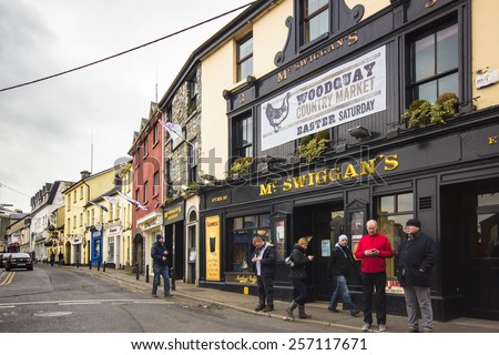 GALWAY CITY, IRELAND - MARCH 31, 2013:  Street scene by an Irish pub in the medieval city of Galway, Ireland.