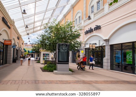 DEER PARK, NY - JULY 22, 2015: View of Tanger Factory Outlet outdoor shopping mall on Long Island, NY near the Stride Rite shoe store