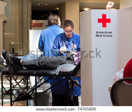 GARDEN CITY, NY - APRIL 3, 2011:  In the wake of the devastation in Japan, American Red Cross blood drive for disaster relief in Garden City, New York in Roosevelt Field Mall.