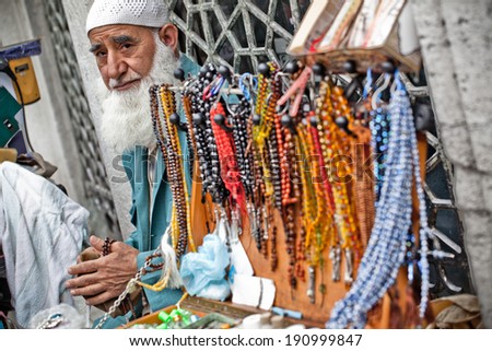 ISTANBUL - MAY 19: Muslim man sells mala beads on the street on May 19, 2011 in Istanbul.