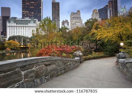 Central Park and Manhattan Skyline. Image of Central Park and Gapstow Bridge in New York City, USA in Autumn.