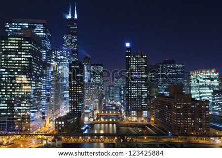 Chicago at night. Image of Chicago downtown and Chicago River with bridges at night.