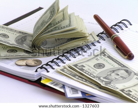 Daily business set - money, the handle, a writing-book, cards...