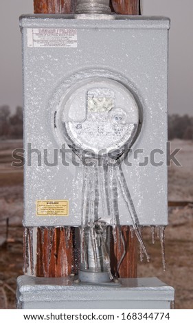 CREEK COUNTY, OKLAHOMA - DECEMBER 21, 2013: Meter box covered in thick layer of ice after an ice storm slams the region causing power outages due to snapped power lines
