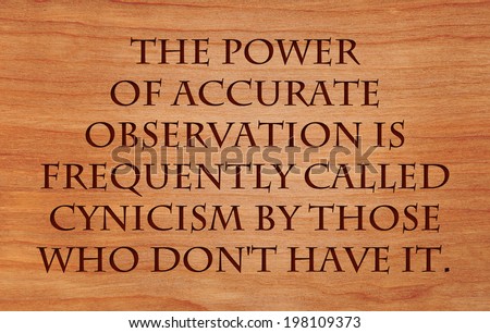 The power of accurate observation is frequently called cynicism by those who don\'t have it  - quote  on wooden red oak background