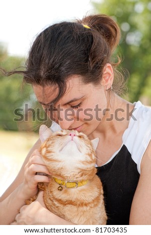 Beautiful girl with her cat, a special moment of affection between friends