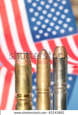 Three bullets on US flag background - concept of homeland defense