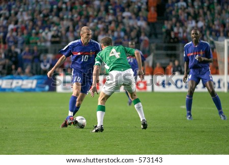 Zinedine Zidanetakes on Kenny Cunningham. Ireland V France,World Cup Qualifier, 7 September 2005, Lansdowne Road Dublin. France won 1-0.