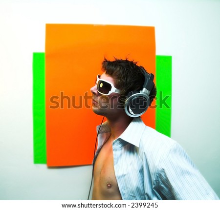 male model posing with  head phones