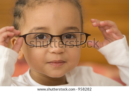 A Beautiful Young Mixed Race Girl Wearing Slightly Oversized Glasses ...