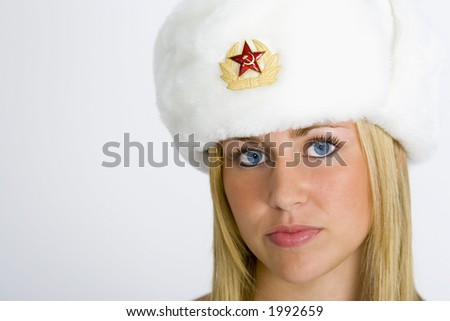 A Beautiful Blonde Russian Model Wearing A Fur Hat Shot In Studio ...