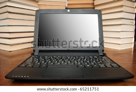 Laptop with books isolated on white background. wide angle.