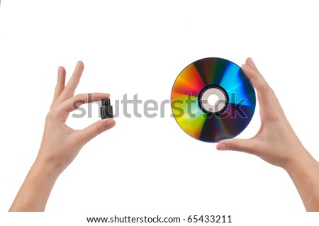Woman`s hands holding pen drive and disc isolated on white background