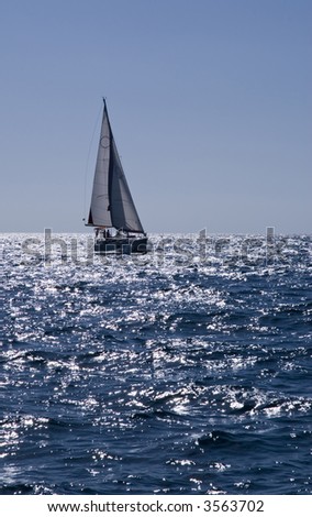 Yacht sailing in blue see