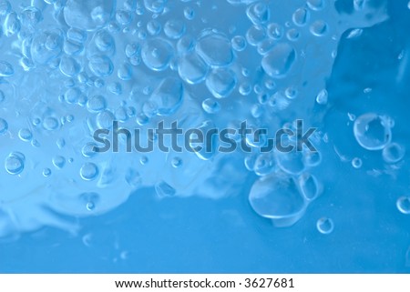 Abstract blue background with air bubbles inside water