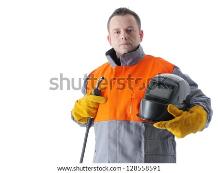 Welder wearing protective suit holding welding hood and gas welding gun on white