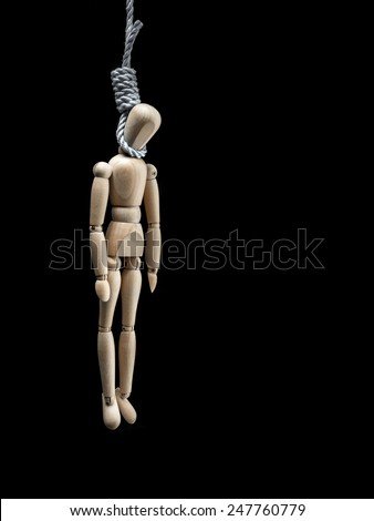 Wooden dummy being hanged by the neck on the noose over black background