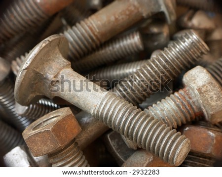 Background of rusty metal bolts and nuts
