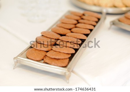 chocolate biscuits on silver tray at restaurant
