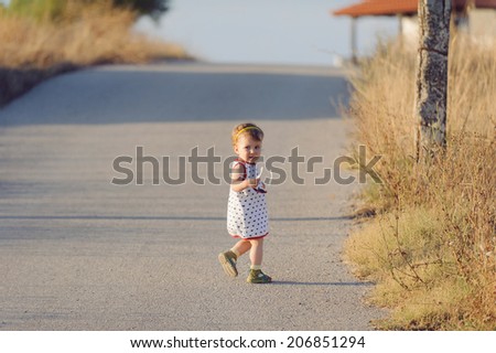 scared girl running on road with sunglasses