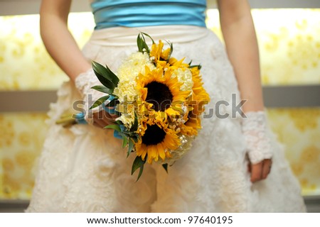 Bride holding wedding bouquet in hands